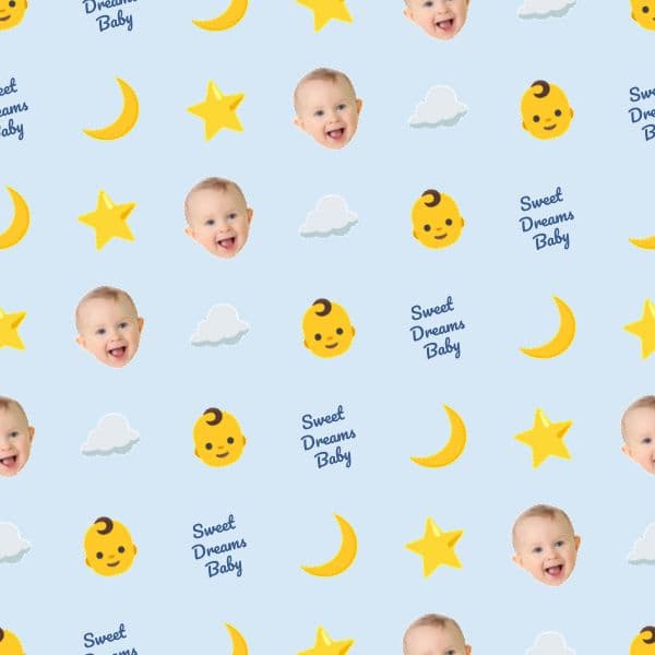 Smiling baby boy surrounded by moons, stars and clouds on pastel blue wrapping paper