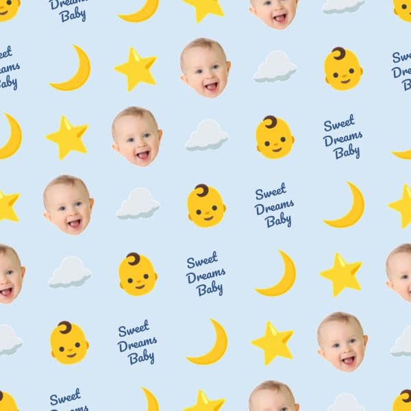 Smiling baby boy surrounded by moons, stars and clouds on pastel blue wrapping paper