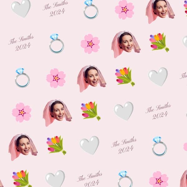 Blush wrapping paper with a smiling bride, florals and the newlywed surname and wedding date in calligraphy