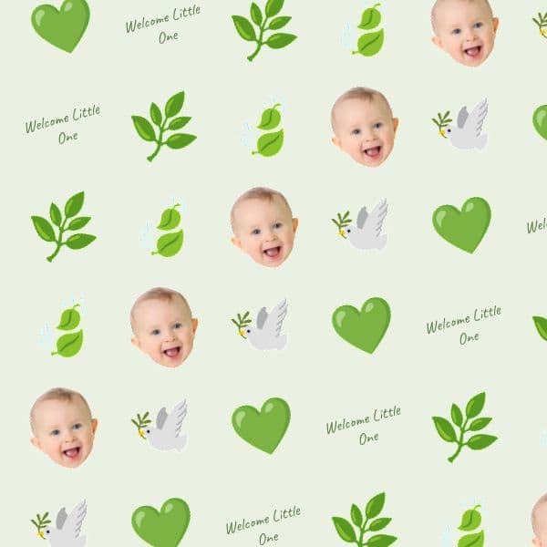Sage-green botanical wrapping paper with delicate leaves, a smiling baby and space for a name and quote