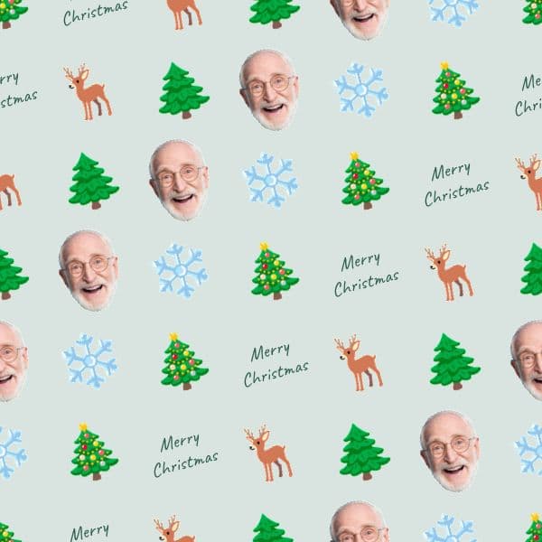 Nordic Christmas wrapping paper with reindeer, snow-dusted pine trees and personalised names in soft winter tones