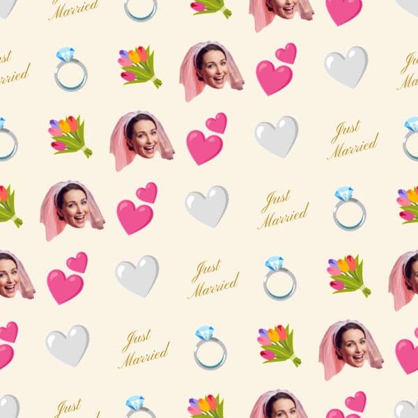 White wrapping paper with gold wedding rings, hearts and flowers framing a smiling bride