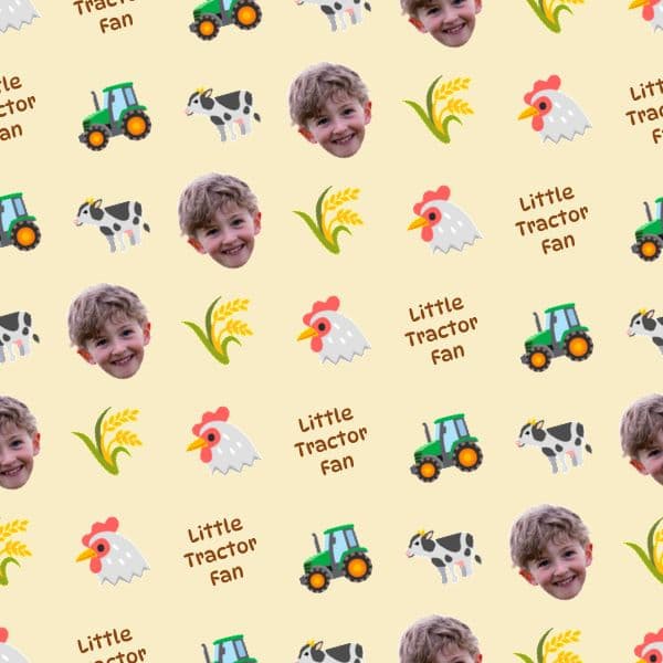 Wrapping paper with cartoon tractors and wooden barn signs on a warm hay-gold background